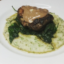 Spice-rubbed duck breast with red wine cream sauce, spinach, and dill mashed potatoes