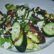 New salad at the restaurant: Heirloom tomato, avocado, cucumber, bleu cheese, fresh basil, shaved red onion, and balsamic vinaigrette.